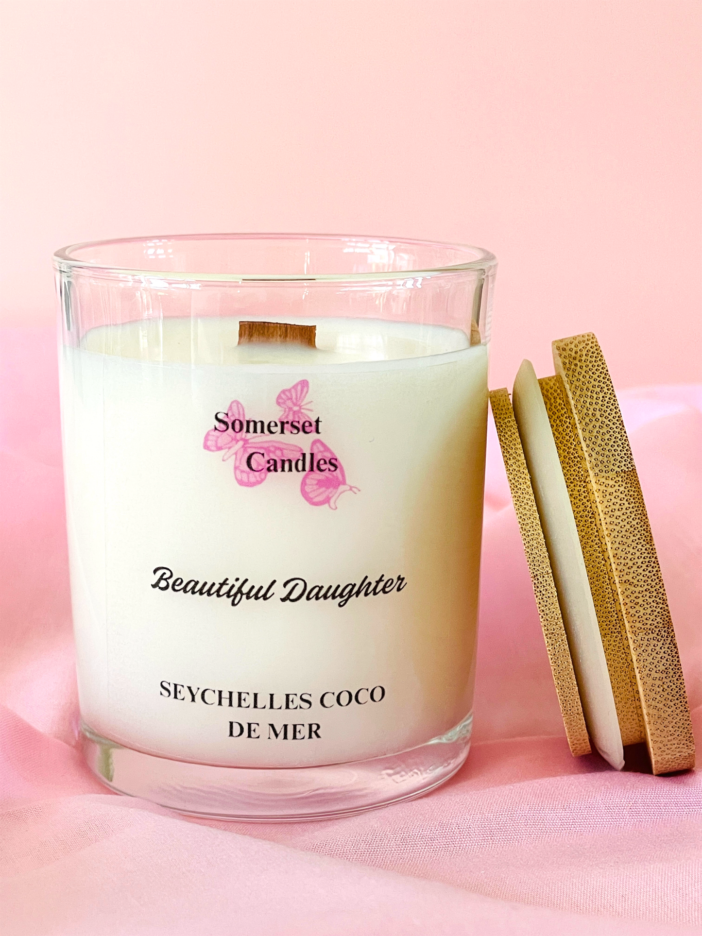 Somerset Candles 'Beautiful Daughter' Seychelles Coco de Mer candle on a pink background