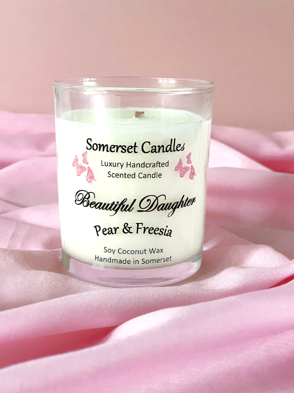 Somerset Candles 'Beautiful Daughter' pear & freesia candle on pink fabric