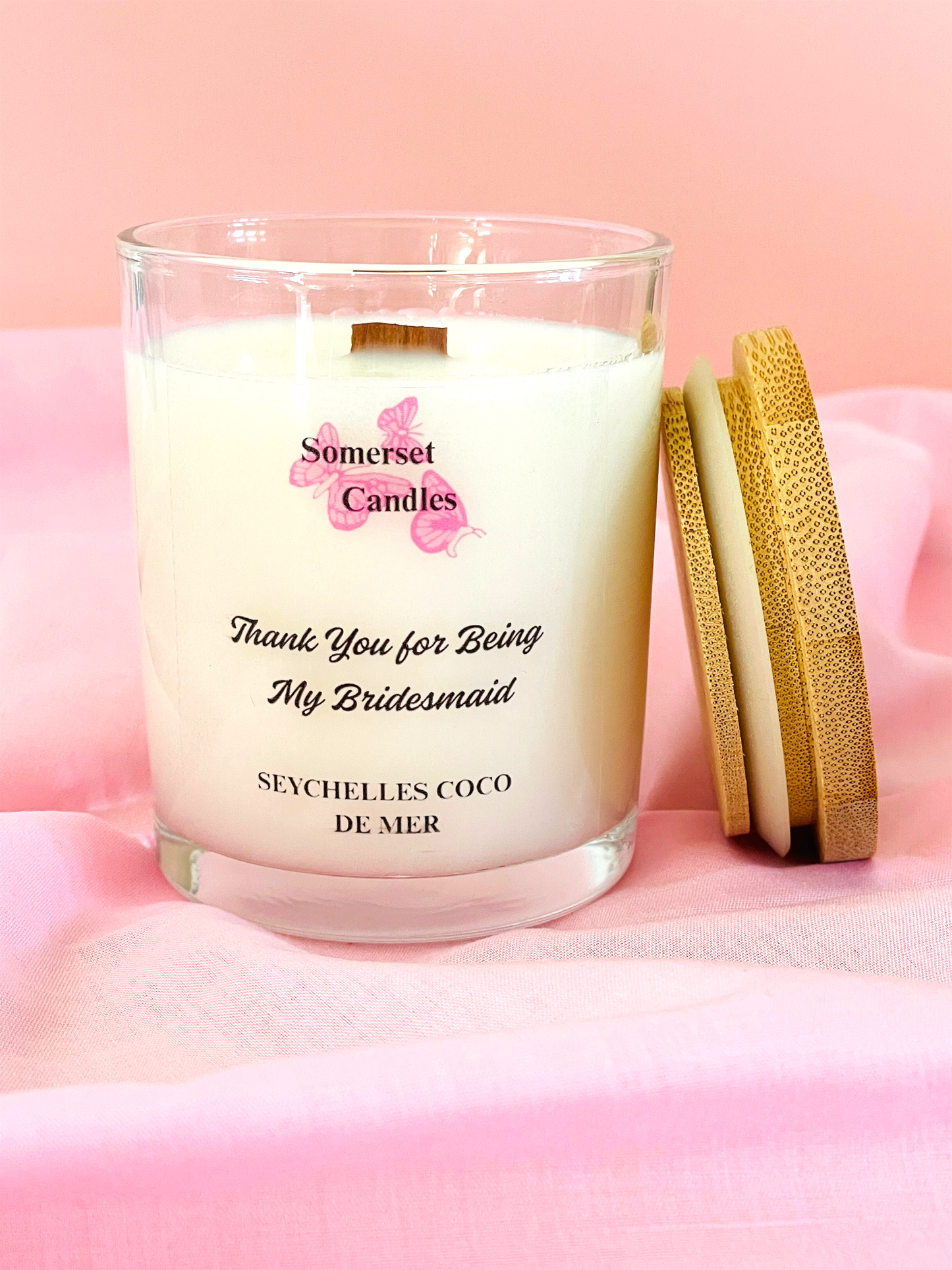 Scented Candles with 'Somerset Candles' branding on a pink background