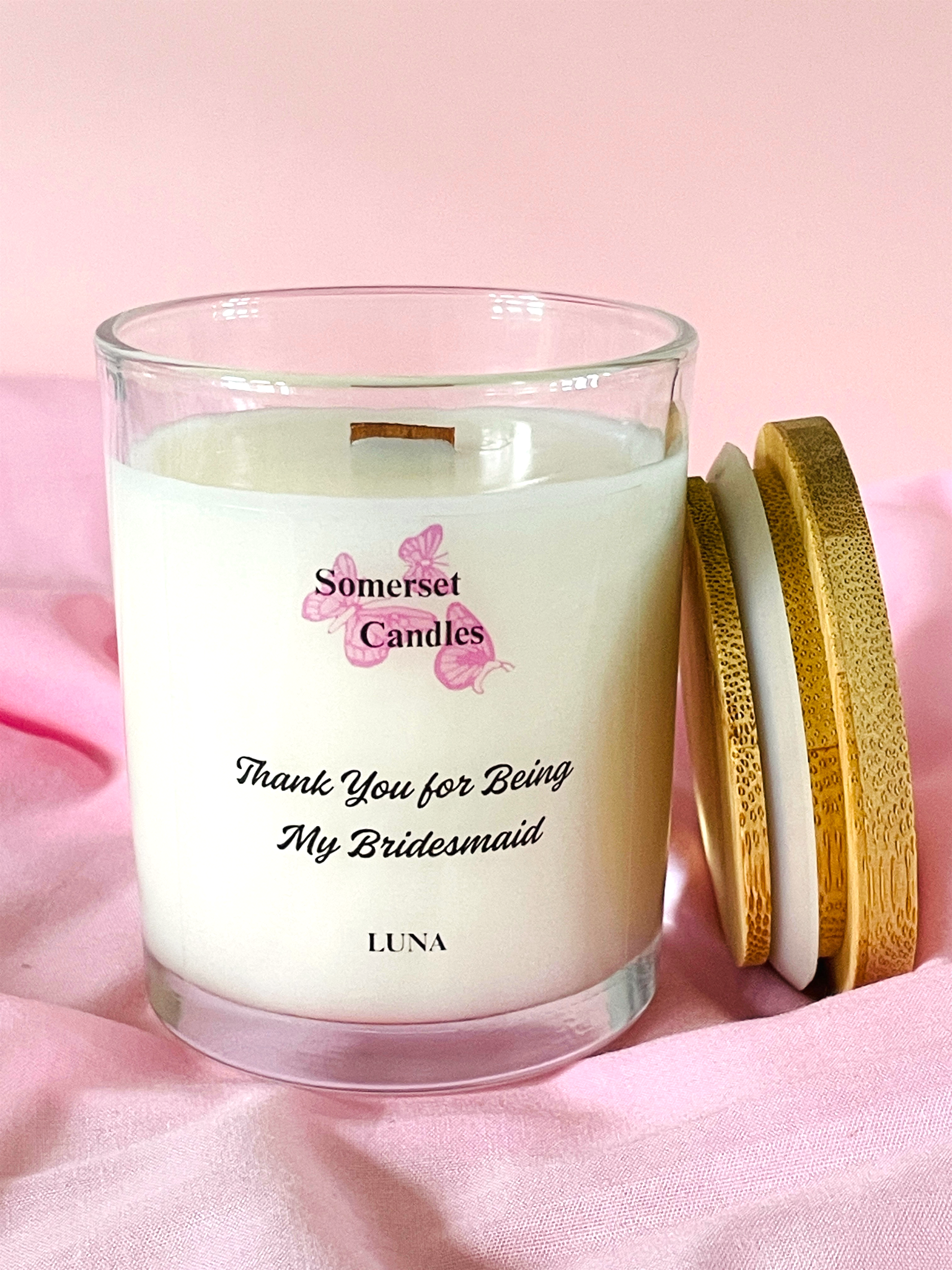 Scented Candle with 'Somerset Candles' branding on a pink background
