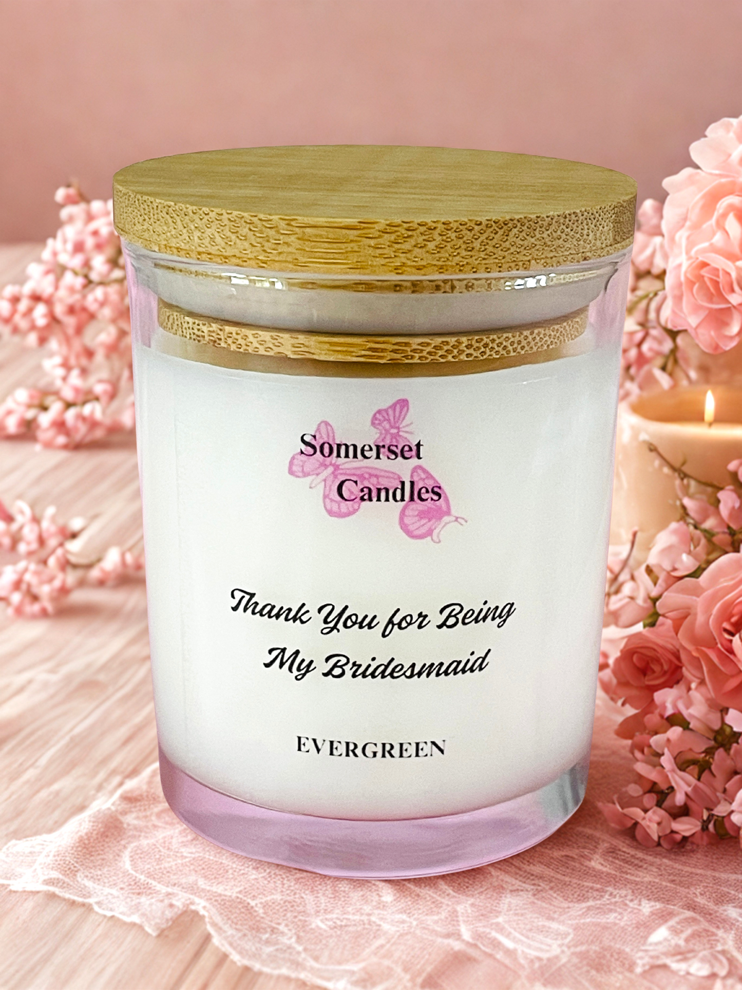 Somerset Candles 'Thank You for Being My Bridesmaid' candle with pink flowers on a pink background