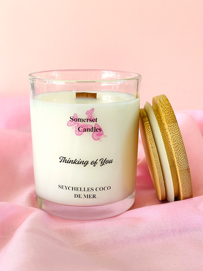 Somerset Candles 'Thinking of You' candle on a pink background