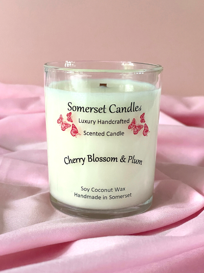 Somerset Candles cherry blossom and plum scented candle on pink fabric