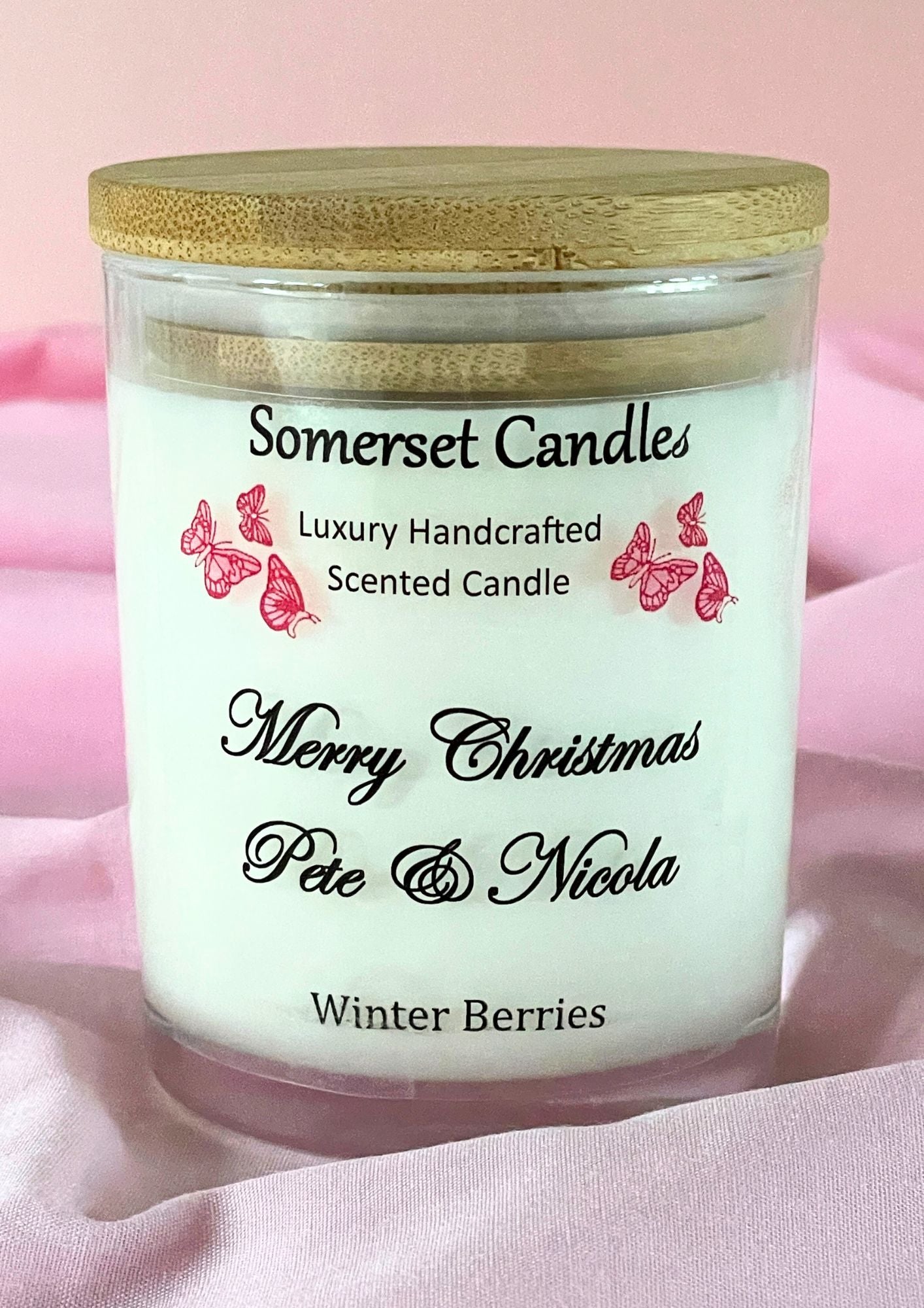 Somerset Candles scented candle with wooden lid on a pink background