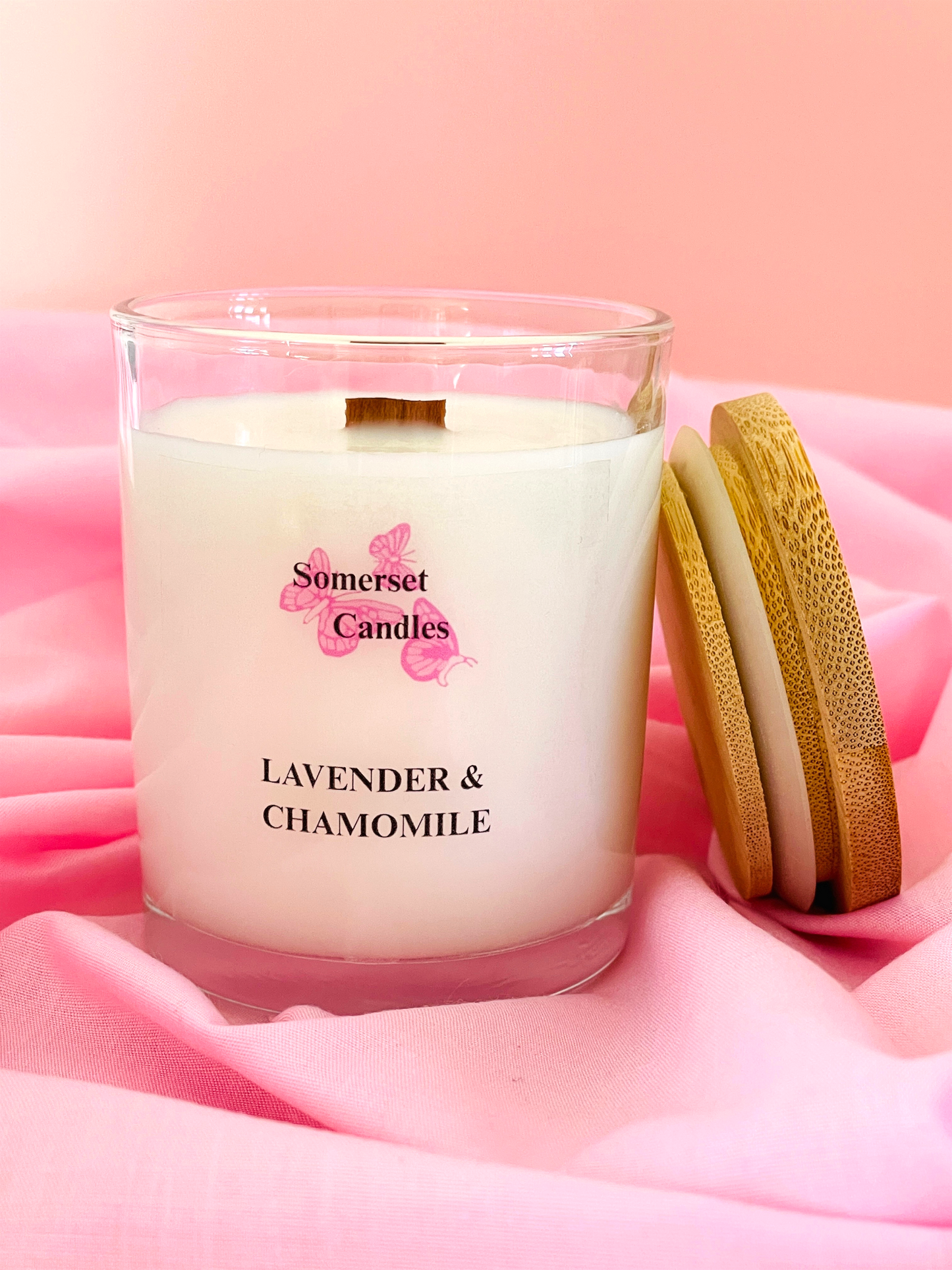 Somerset Candles lavender and chamomile candle on pink fabric
