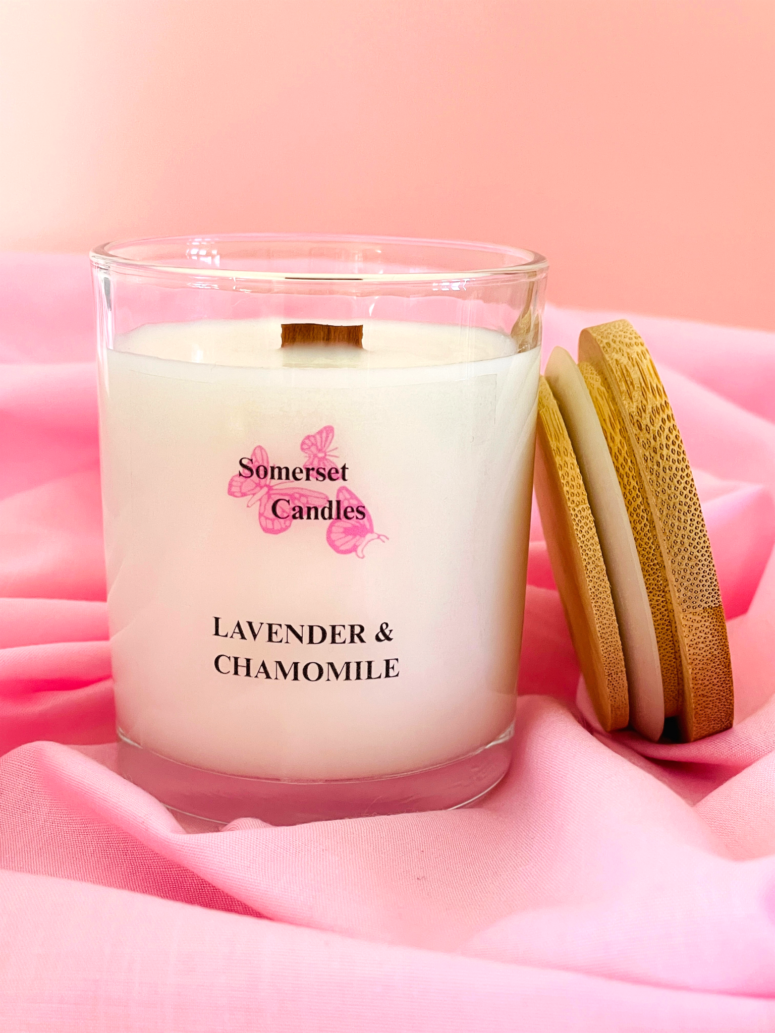 Somerset Candles lavender and chamomile candle on pink fabric