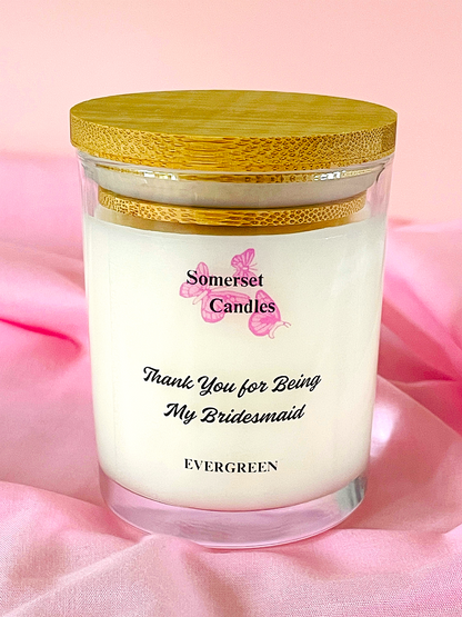 Scented Candle with 'Somerset Candles' branding on a pink fabric background