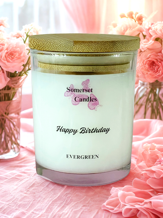 Somerset Candles 'Happy Birthday' candle with pink flowers in the background