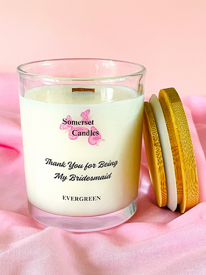 Somerset Candles 'Thank You for Being My Bridesmaid' candle on a pink background