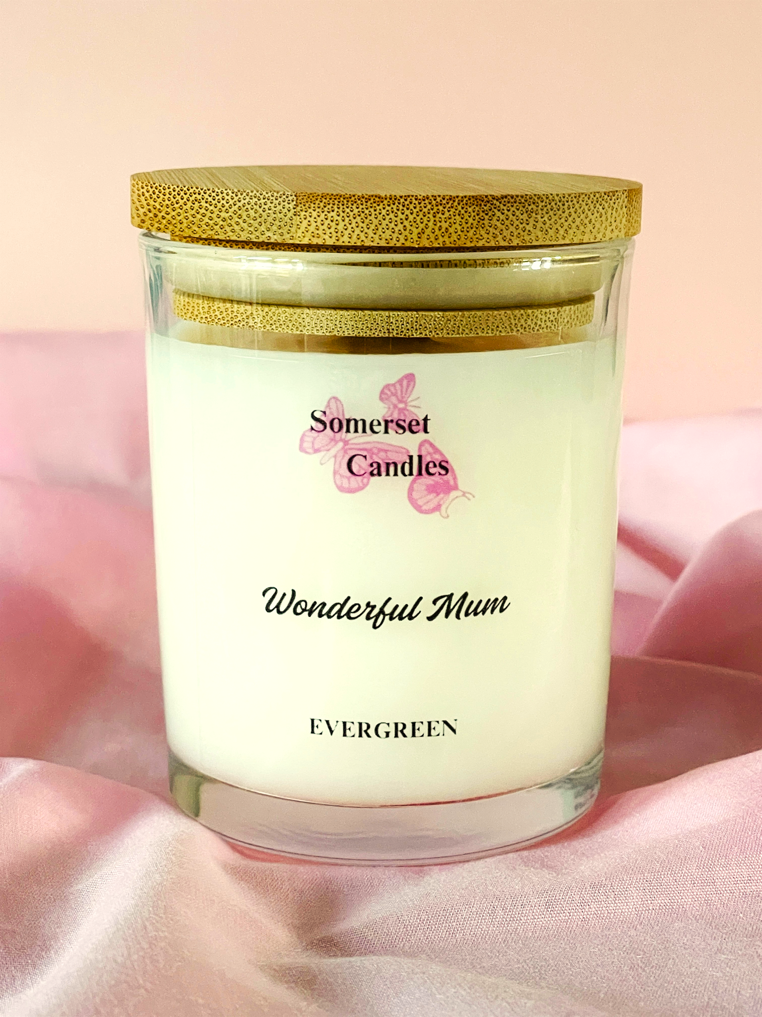 Somerset Candles 'Wonderful Mum' candle with wooden lid on a pink background