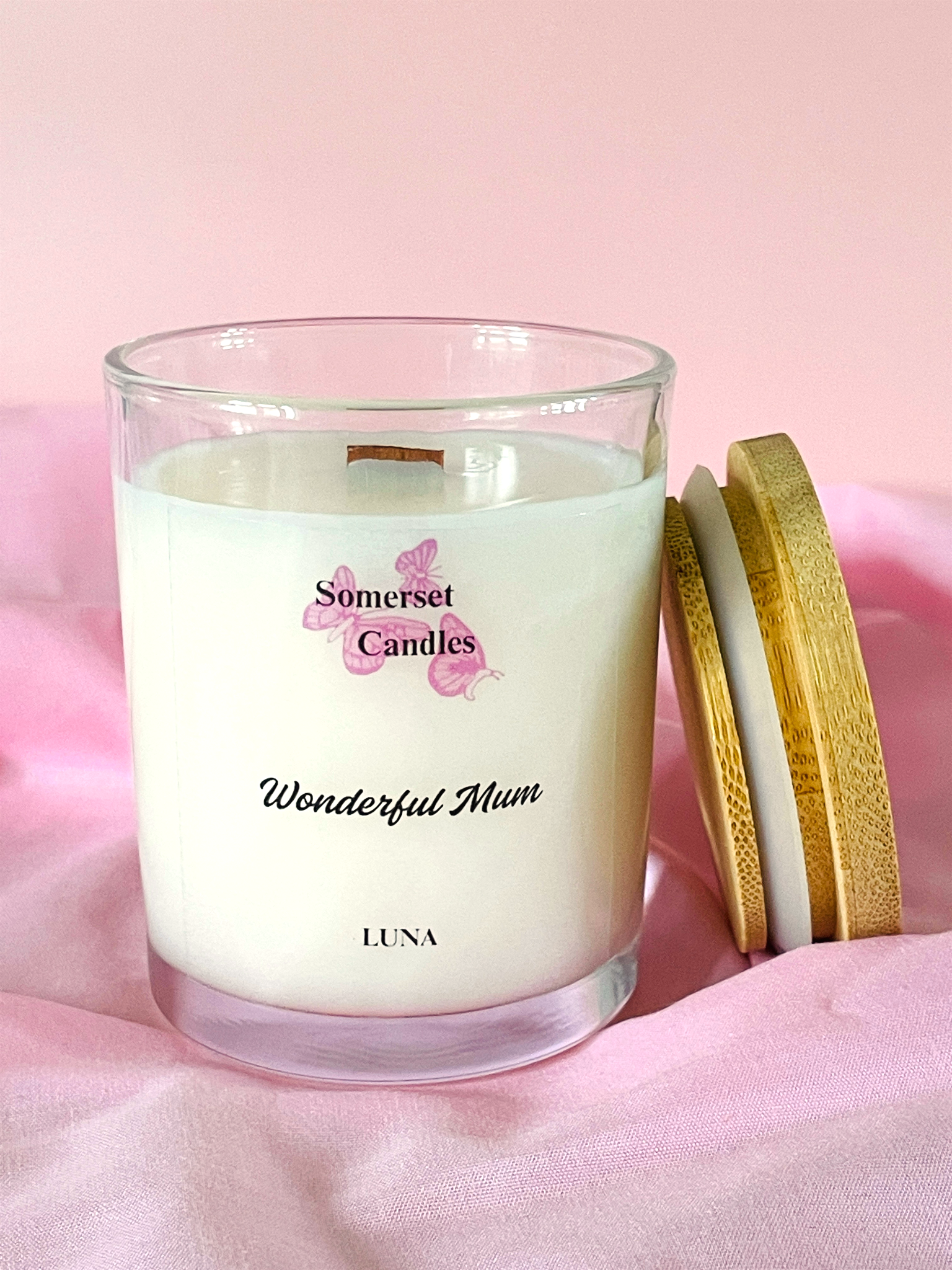 Somerset Candles 'Wonderful Mum' candle with wooden lid on a pink background