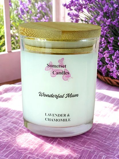 Somerset Candles 'Wonderful Mum' lavender and chamomile candle with a lavender plant in the background.