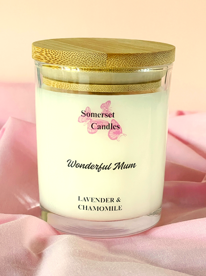 Somerset Candles 'Wonderful Mum' lavender and chamomile candle on a pink fabric background