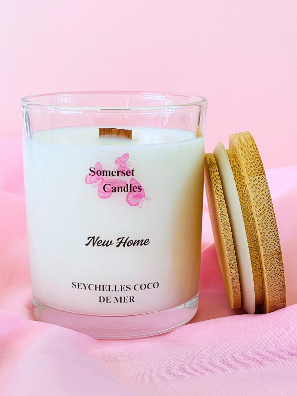 Somerset Candles New Home Seychelles Coco de Mer candle on a pink background