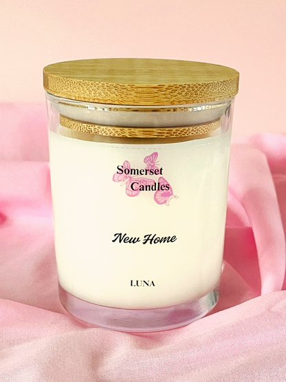 Somerset Candles New Home Luna candle with wooden lid on a pink background