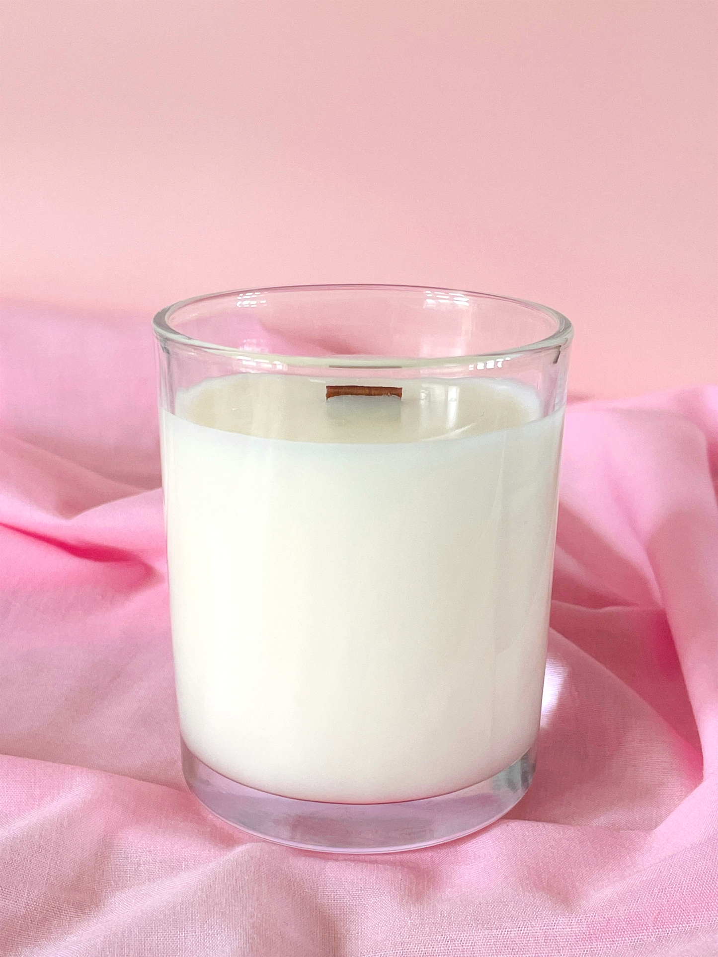 Scented Candle No Label Minimalist Coconut Wax on a pink fabric background