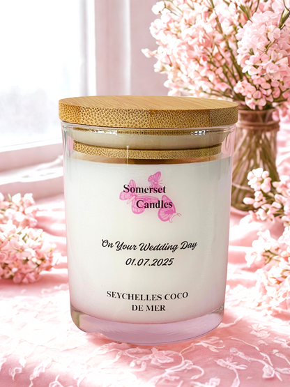 Candle with 'Somerset Candles' branding on a pink floral background