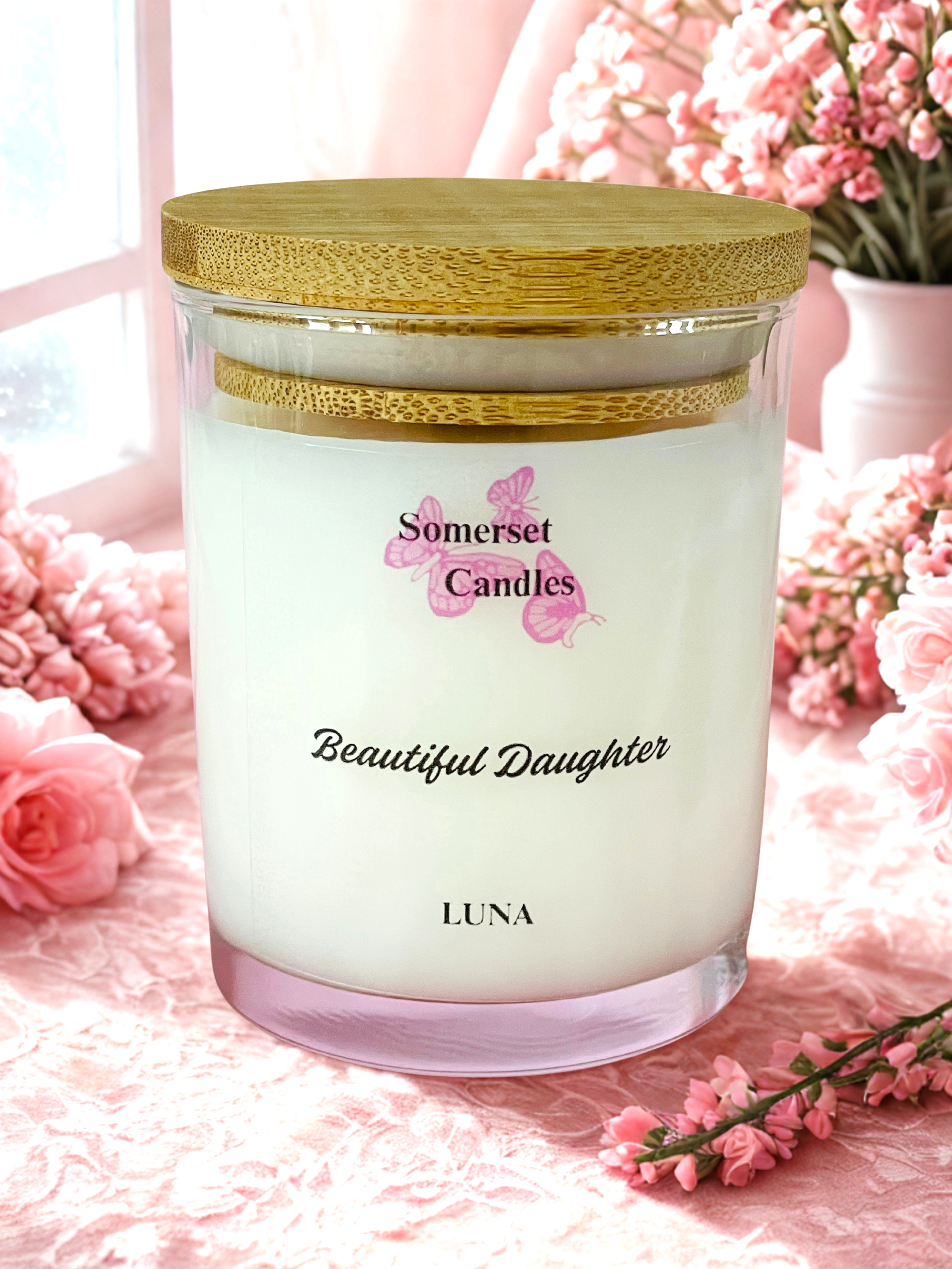 Somerset Candles 'Beautiful Daughter' Luna candle with pink flowers in the background