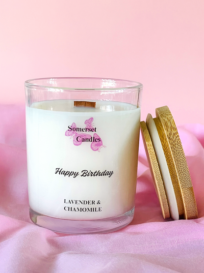 Somerset Candles birthday candle with lavender and chamomile scent on a pink background
