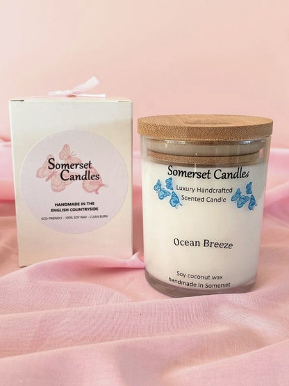 Somerset Candles 'Ocean Breeze' candle with packaging on a pink background