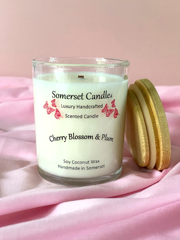 Somerset Candles cherry blossom & plum scented candle with a pink background