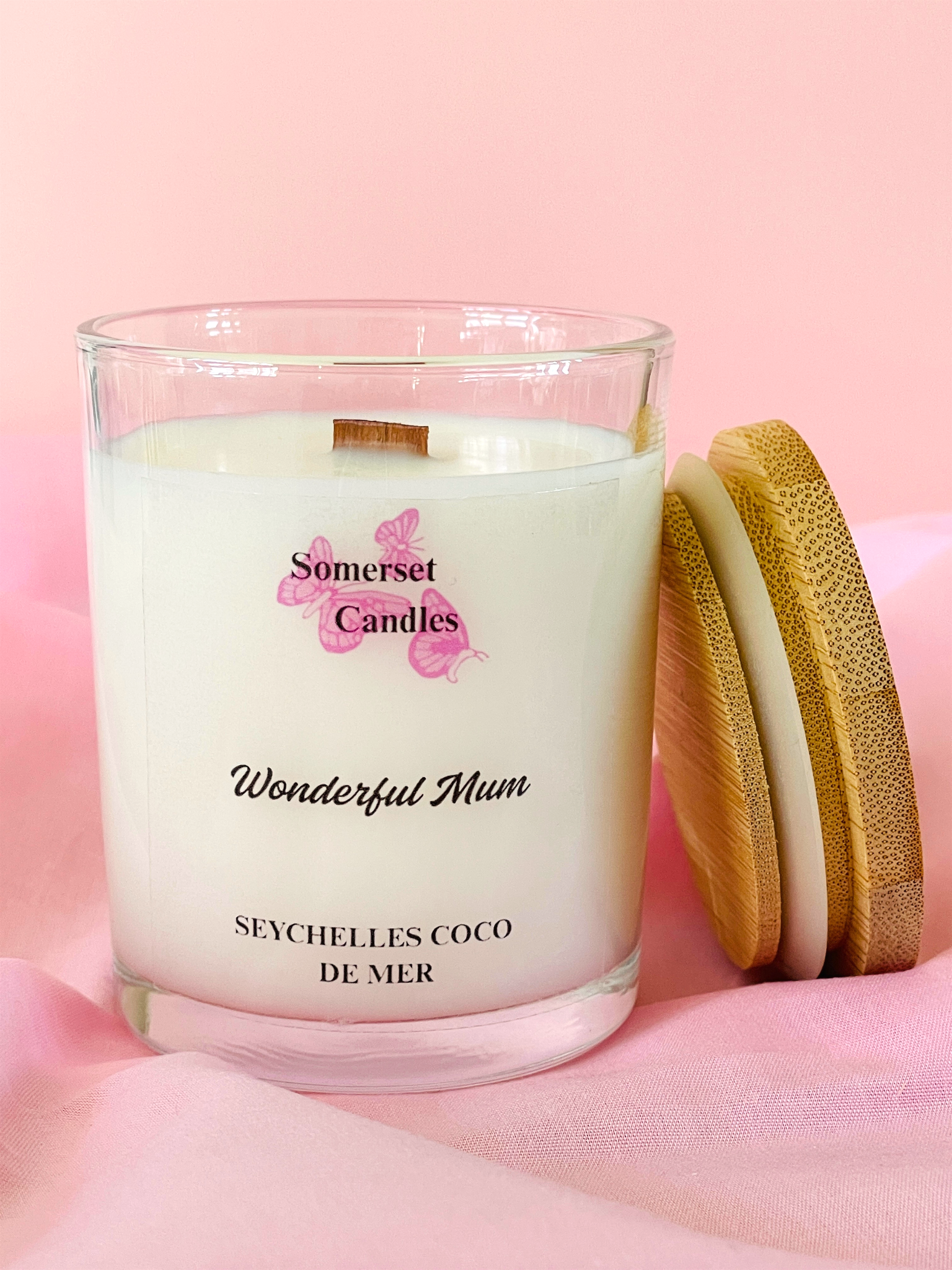 Somerset Candles 'Wonderful Mum' candle with wooden lid on a pink background