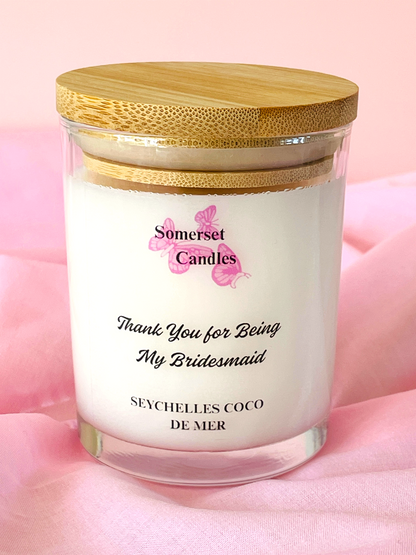 Coconut Wax Candle with a wooden lid on a pink background, featuring the brand 'Somerset Candles'