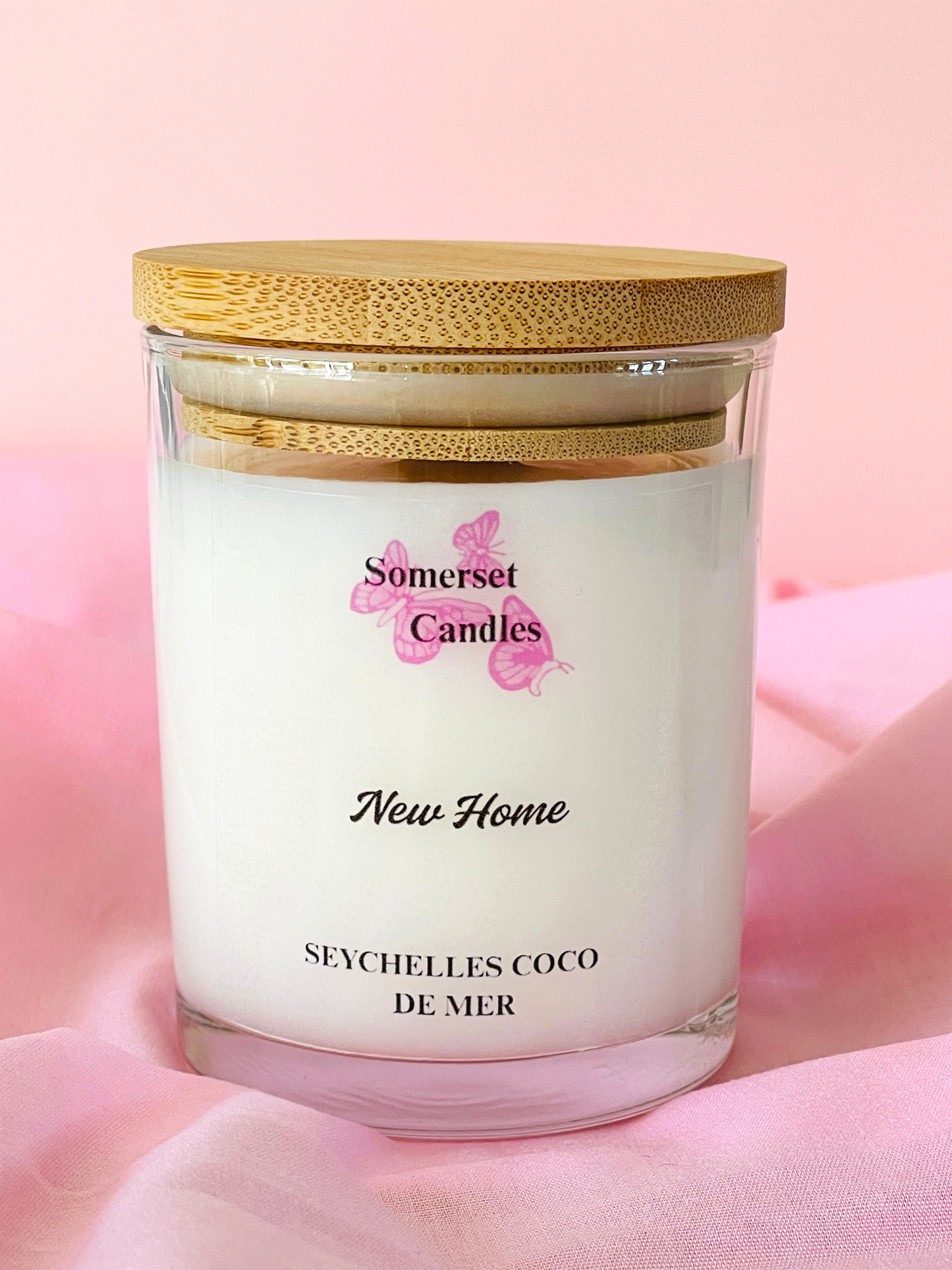 Somerset Candles New Home Seychelles Coco de Mer candle on a pink background