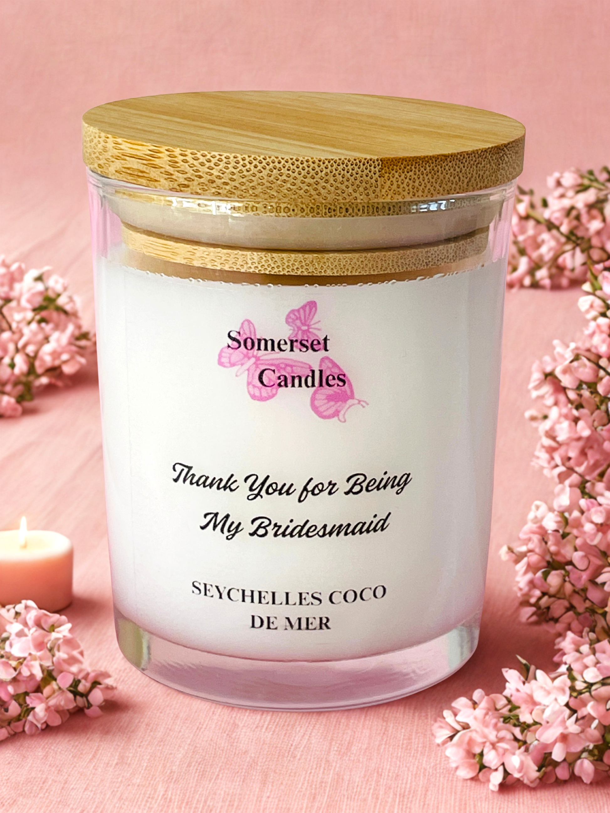 Somerset Candles 'Thank You for Being My Bridesmaid' candle with pink flowers on a pink background