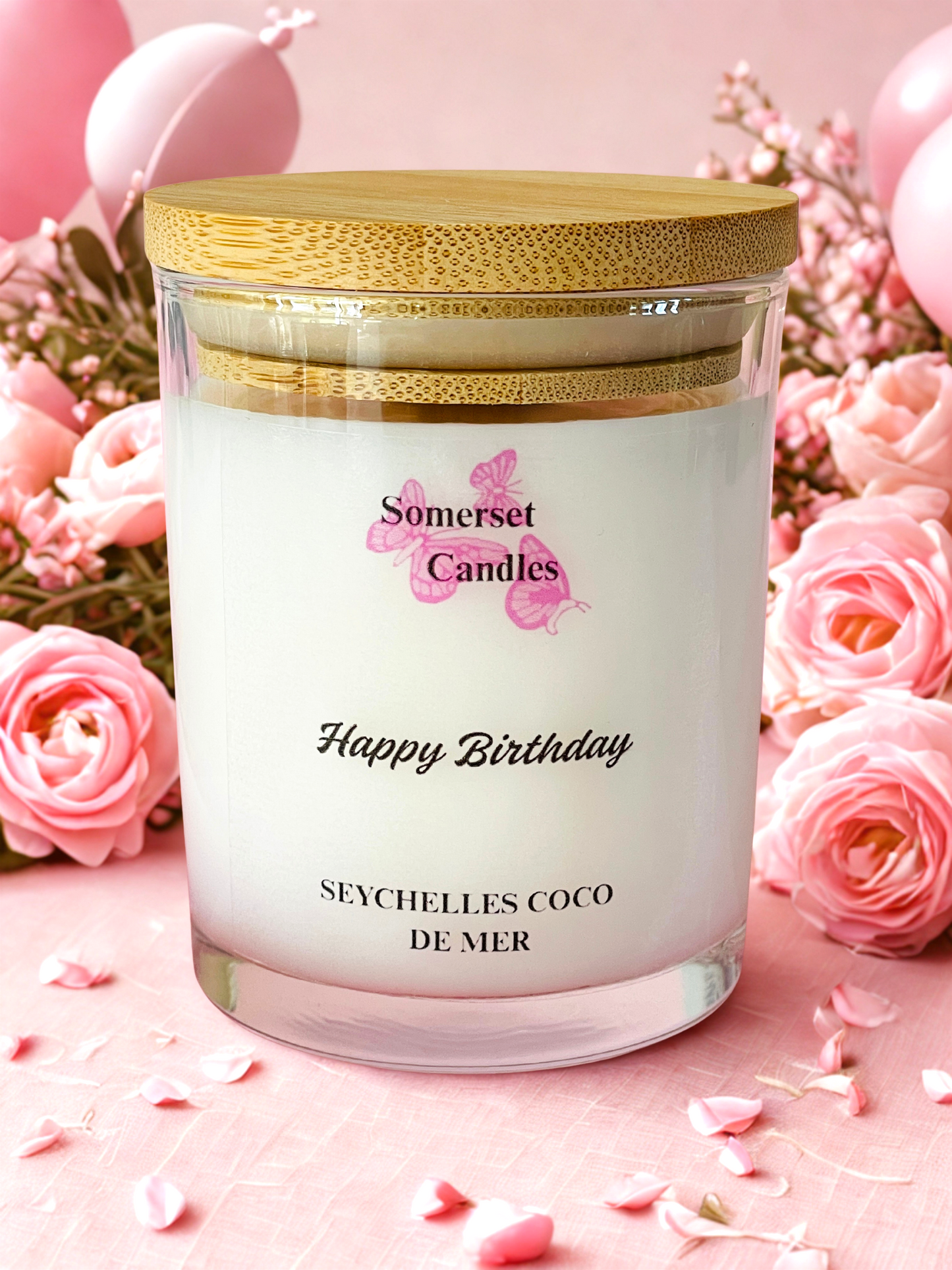 Somerset Candles birthday candle with pink roses and balloons in the background