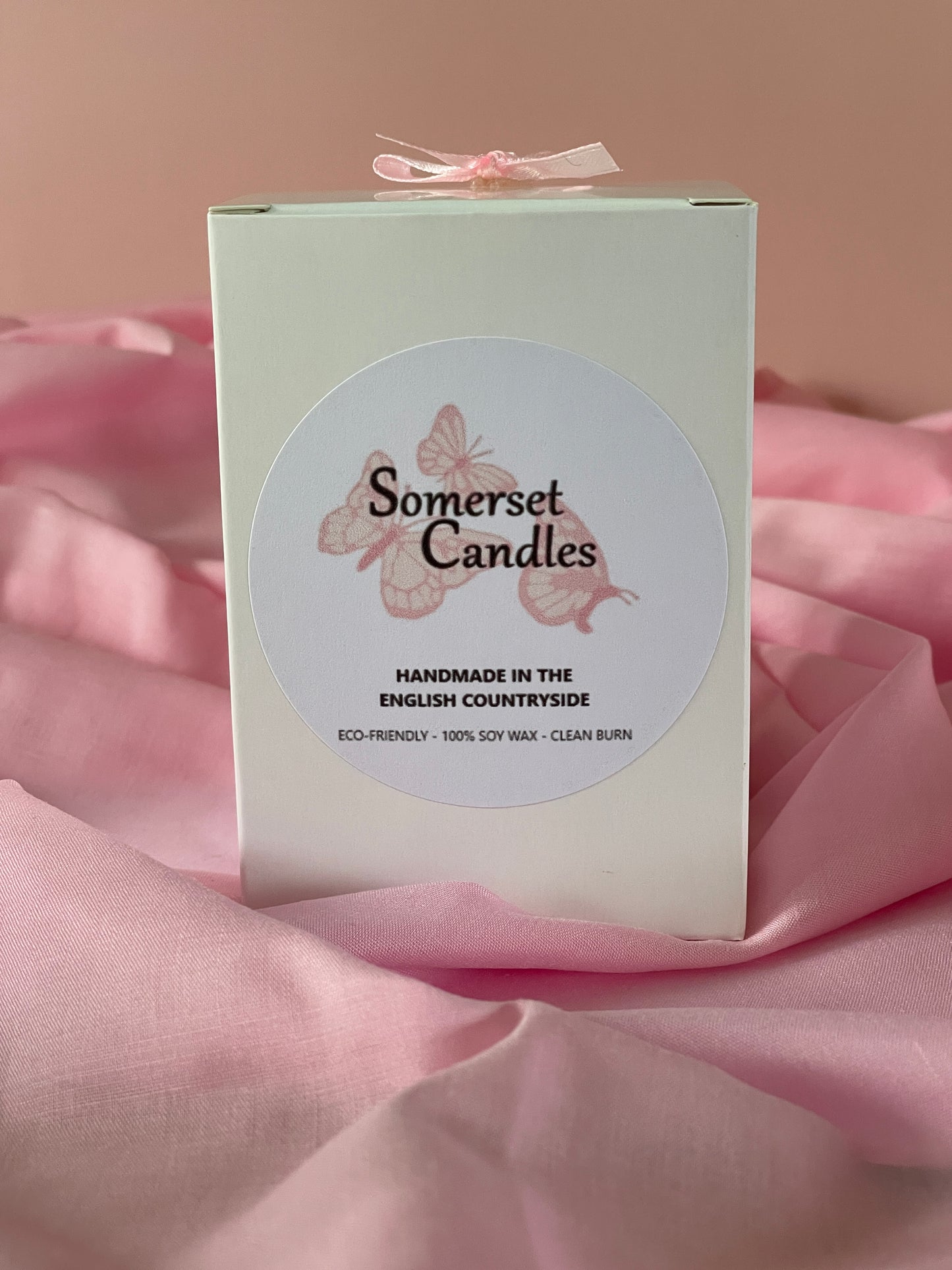 Somerset Candles packaging with a pink background