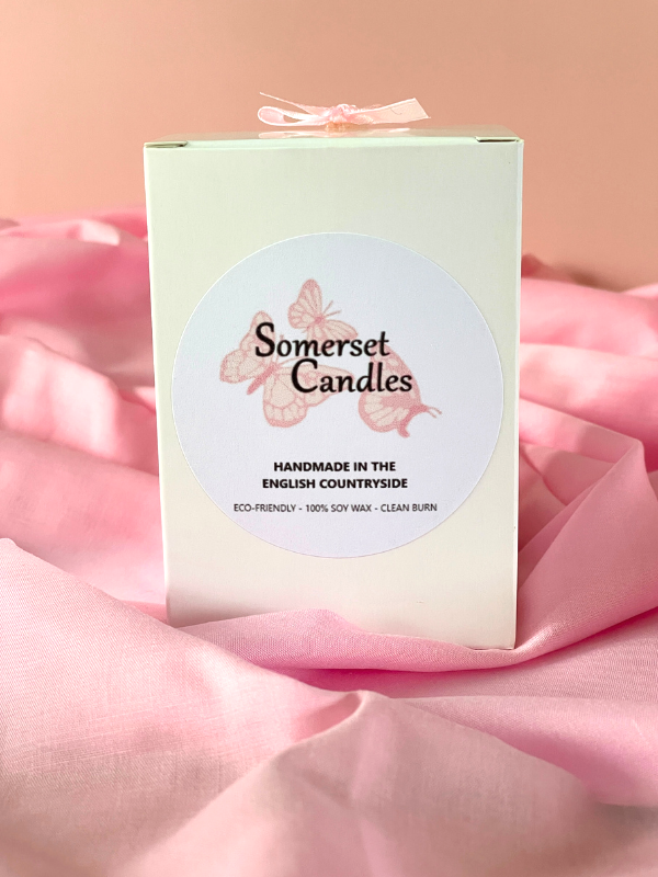 Somerset Candles packaging on pink fabric