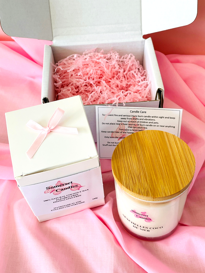 Cosmetic product with wooden lid and packaging on pink fabric