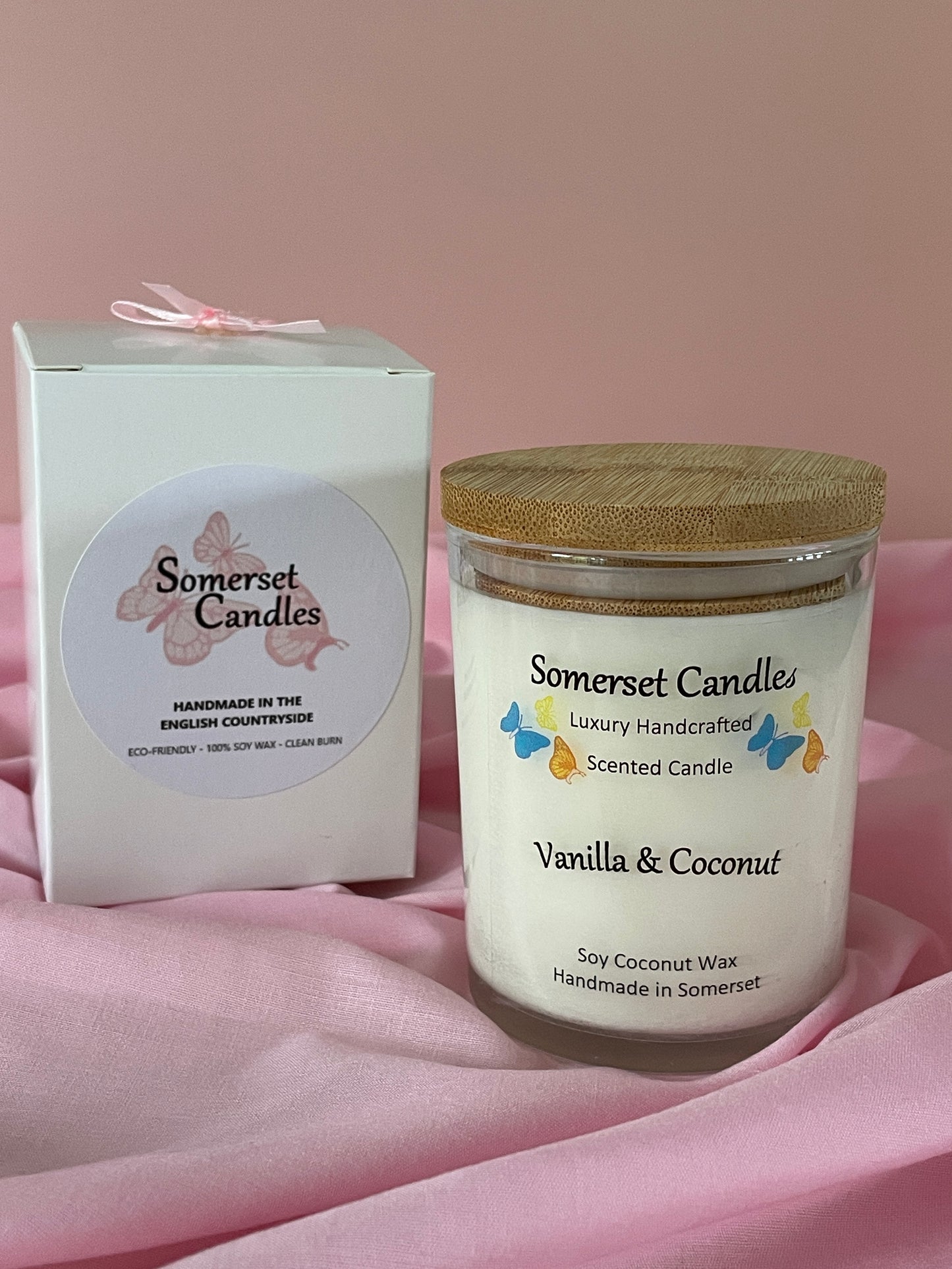 Somerset Candles Vanilla & Coconut scented candle on a pink background