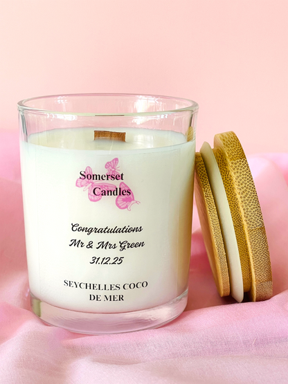 Scented candle with a personalised message on a pink background