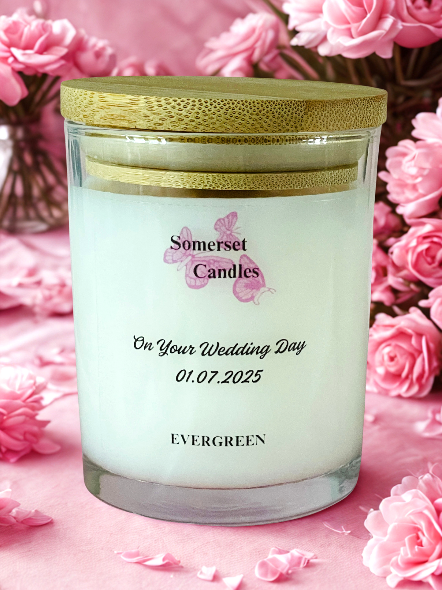 Personalized candle with 'Somerset Candles' branding on a pink floral background