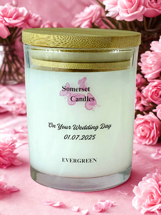 Personalized candle with 'Somerset Candles' branding on a pink floral background