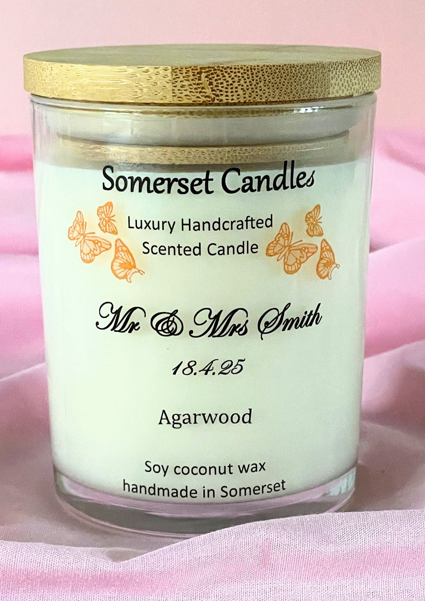 Somerset Candles scented candle with gold lid on a pink background