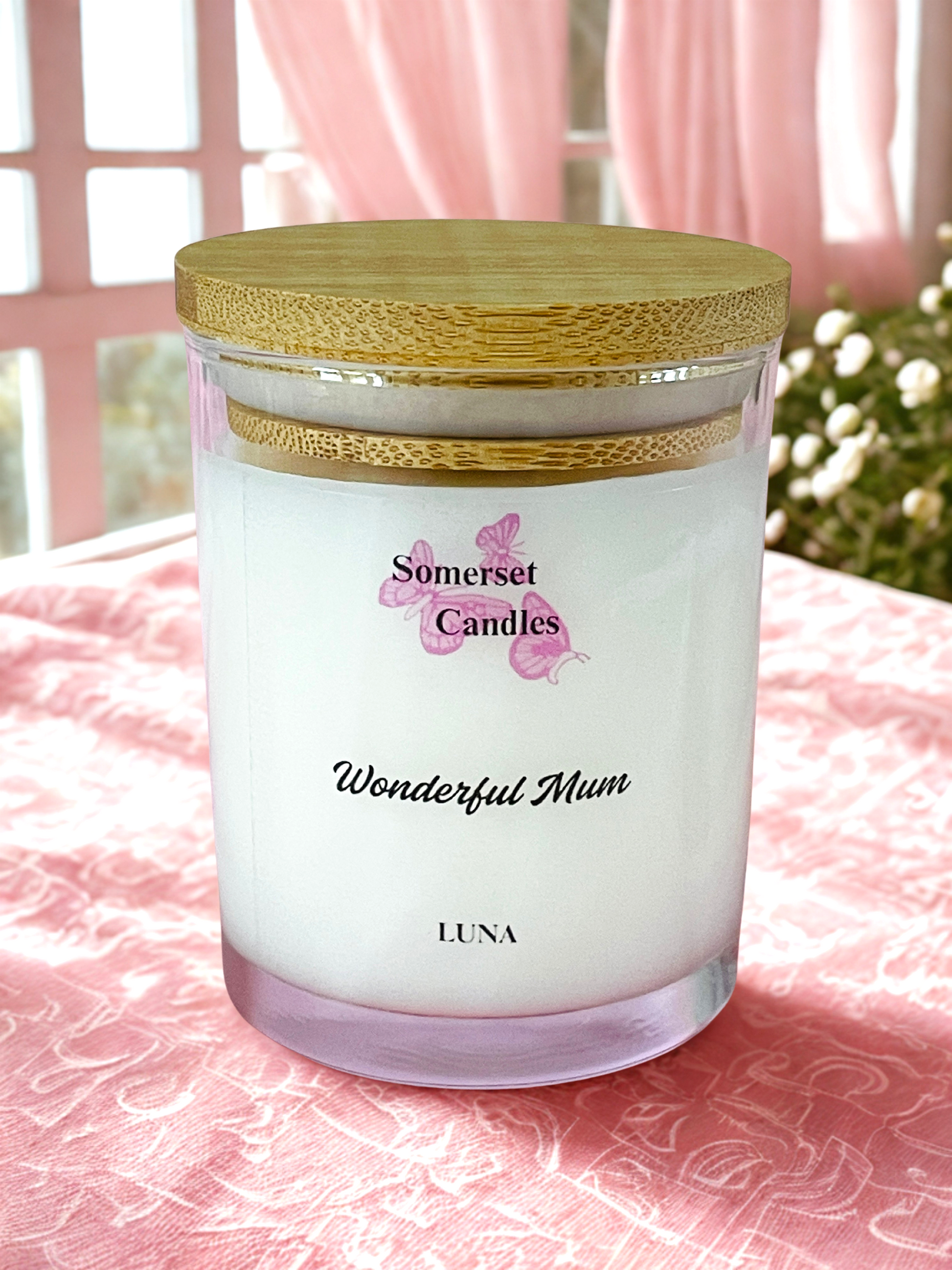 Somerset Candles 'Wonderful Mum' Luna candle on a pink surface with floral background