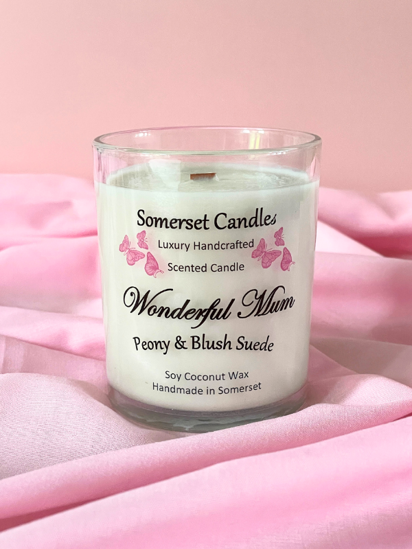 Somerset Candles scented candle labeled 'Wonderful Mum' on a pink fabric background