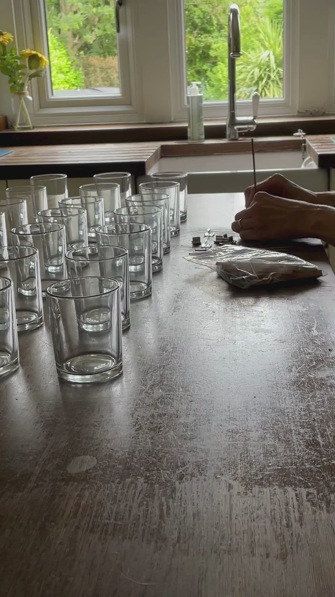 Load video: Video showing wicking up of the glasses in preparation to hand pour the candles